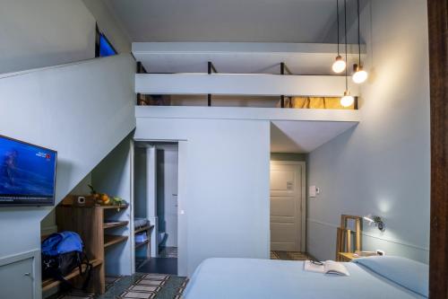 Un pat sau paturi într-o cameră la Il Roseto