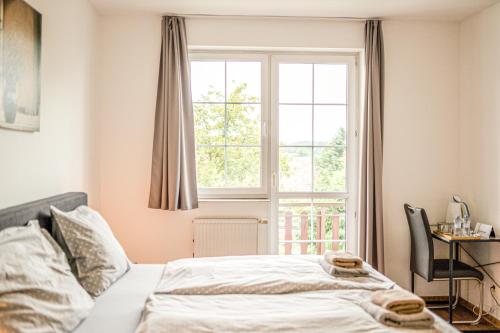 a bedroom with a bed and a window at JEZ&SPI Plánice in Plánice