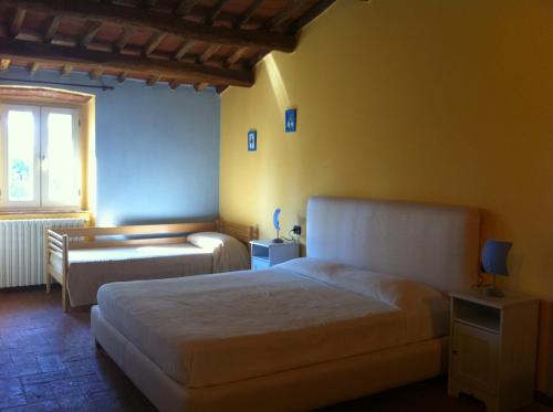 Katil atau katil-katil dalam bilik di La Corte del Fumetto