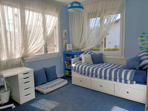 Postel nebo postele na pokoji v ubytování Casa acogedora familiar en la montaña