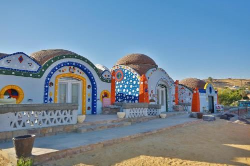 a building with colorful designs on the side of it at Anakato Nubian Experience in Aswan