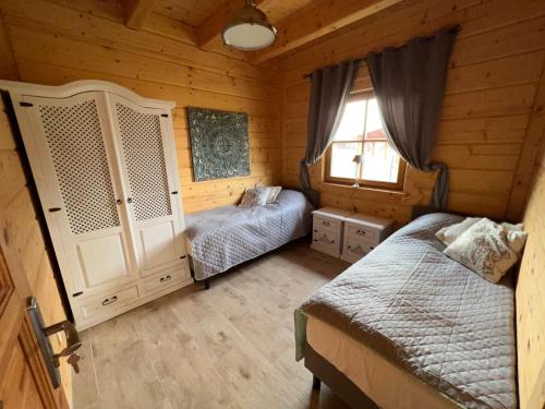 Voodi või voodid majutusasutuse Wolimierz 80 toas