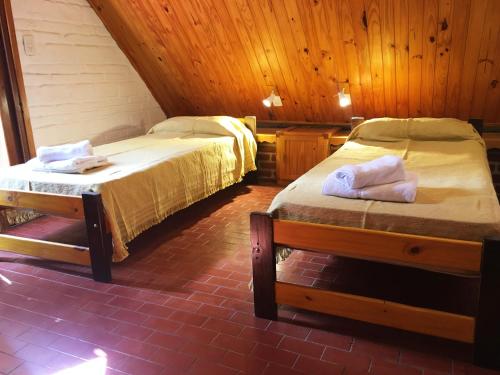 מיטה או מיטות בחדר ב-El Remanso