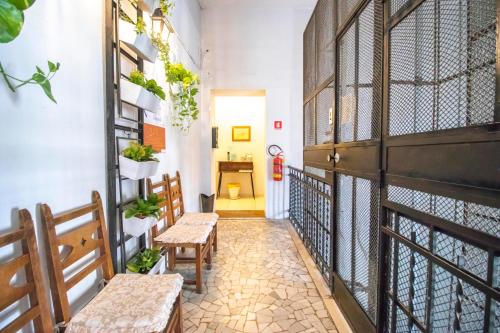 a hallway with benches and a toilet in a room at A I R Rettifilo Apartments in Naples