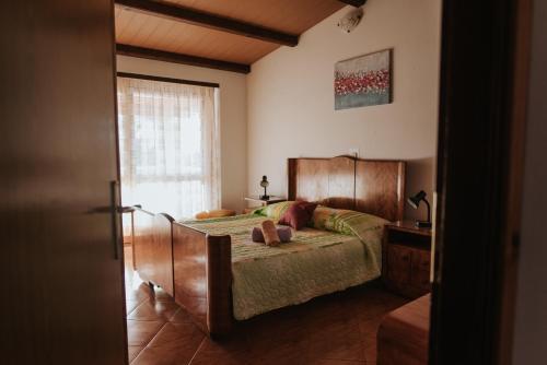 House Diminić tesisinde bir odada yatak veya yataklar