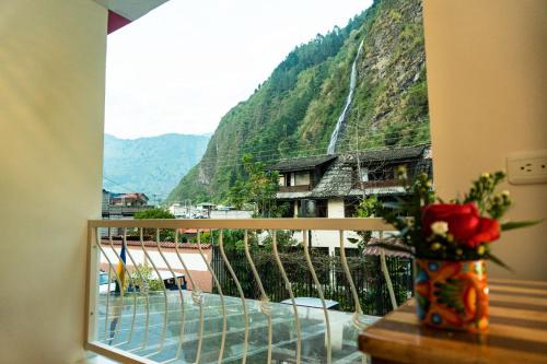 a balcony with a view of a mountain at Hotel De Mi Pueblo in Baños