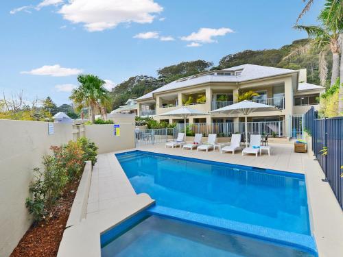an image of a house with a swimming pool at Oceans Eleven at Iluka Resort Apartments in Palm Beach