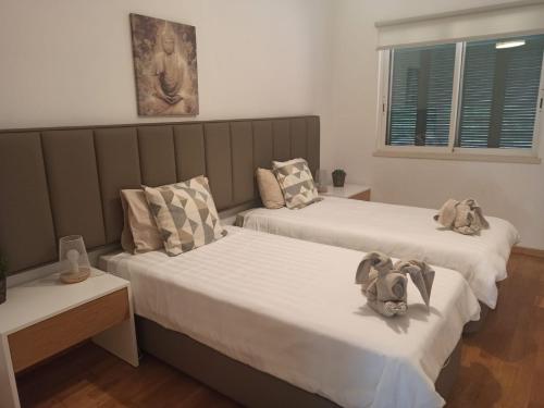 Katil atau katil-katil dalam bilik di Aroeira Lisbon Golf & Beach