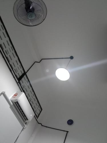 a ceiling with a fan and a light on it at Lavendrata I in Phnom Penh