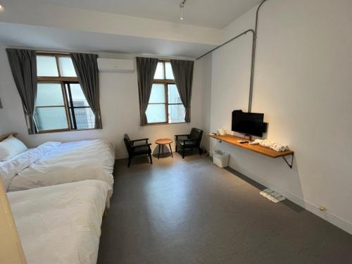 Ένα ή περισσότερα κρεβάτια σε δωμάτιο στο Rolling Pin Homestay