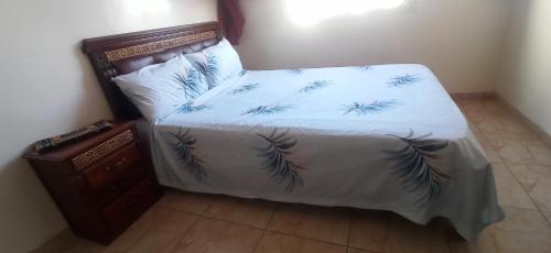 Postel nebo postele na pokoji v ubytování Maison de la famille