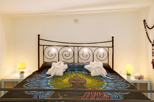 Tempat tidur dalam kamar di Villa Elsa