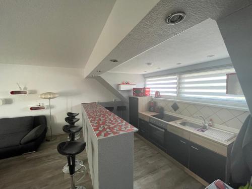 a kitchen with a counter and a sink in a room at Richter Apartments Finsterwalde in Finsterwalde