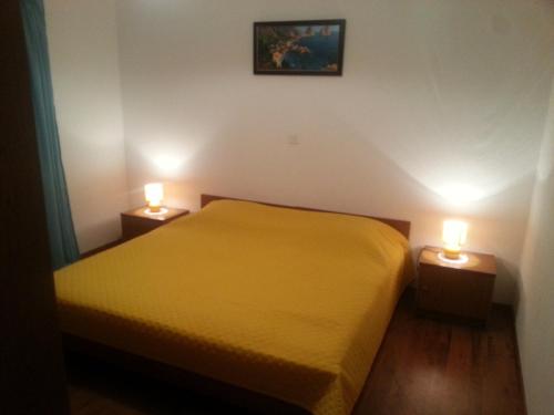 Postel nebo postele na pokoji v ubytování Apartments Maikidan