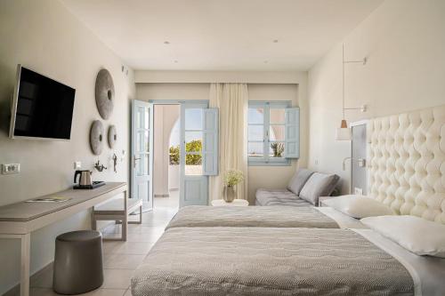Ένα ή περισσότερα κρεβάτια σε δωμάτιο στο El Greco Resort & Spa