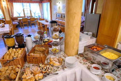 a buffet of food on a table in a restaurant at Hotel Julianin dvor in Habovka