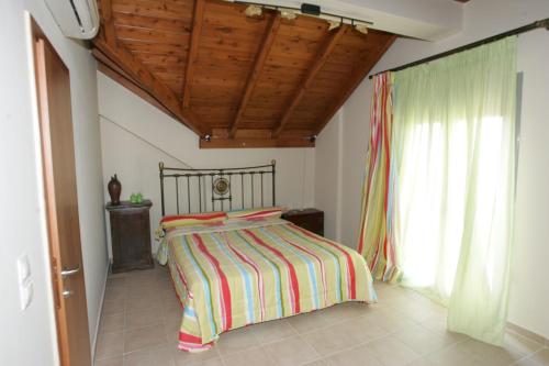 Postel nebo postele na pokoji v ubytování Erofili Villas