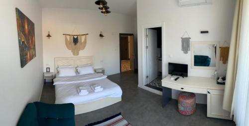 Una cama o camas en una habitación de Moya Urla Butik Otel
