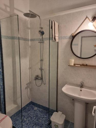 a bathroom with a shower and a sink at Hotel Nautilos in Sozopoli
