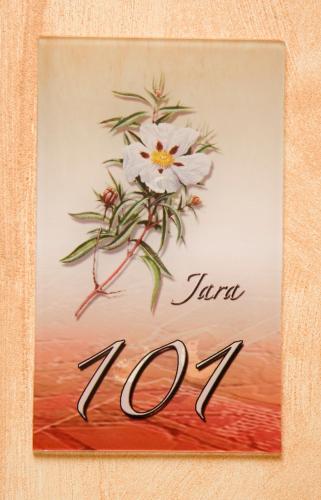 a painting of a white flower on a picture at Hotel Rural El Arriero in La Zarza