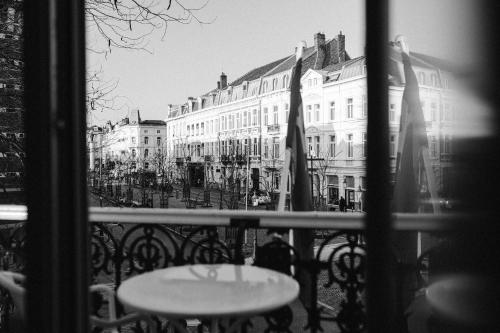 a balcony with a table and chairs and buildings at Alex Maastricht in Maastricht