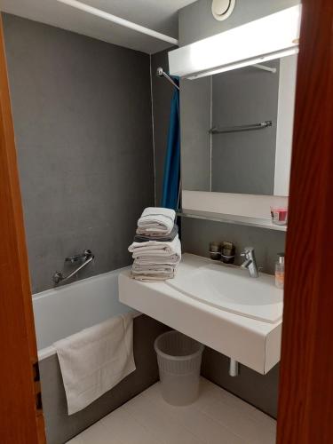 a bathroom with a sink and a mirror at Résidence Panorama A201 in Villars-sur-Ollon