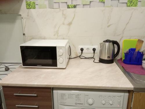 Kuchyňa alebo kuchynka v ubytovaní Apartment Harkovskaya 1 floor