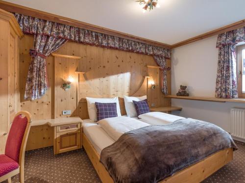 En eller flere senge i et værelse på Appartements Alpenschlössl