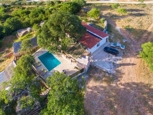 an overhead view of a house with a swimming pool at Luxury house Ivan with 4 bedrooms in Divojevići