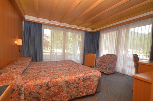 Postel nebo postele na pokoji v ubytování Hotel Trento