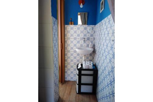 a bathroom with a sink and a mirror at Bangalô Boa Ventura in Lumiar