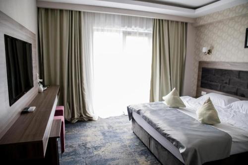 Postel nebo postele na pokoji v ubytování Hotel Yarus Plus