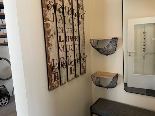 a bathroom with a toilet and a mirror at Ferienhaus Küstelnest in Medebach