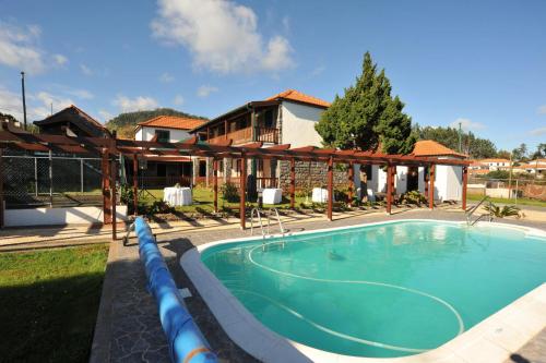 a swimming pool in front of a house at Casa D'Avo Beatriz in Gaula