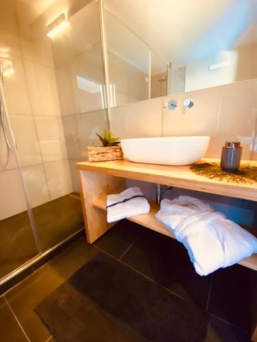 a bathroom with a sink and a mirror at La casina rossa Affittacamere in La Spezia