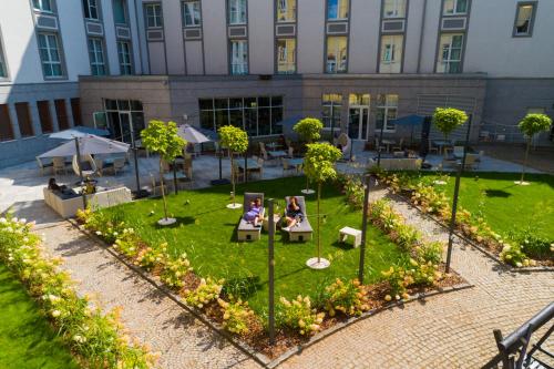 an aerial view of a park in front of a building at Radisson Blu Hotel Wroclaw in Wrocław