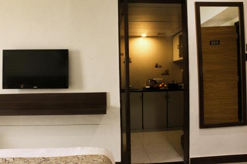 Televisyen dan/atau pusat hiburan di Regenta Place The Emerald