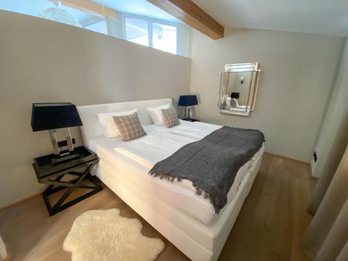 מיטה או מיטות בחדר ב-Suiten Am Schloss