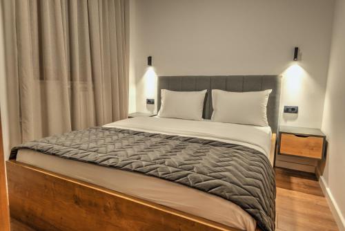 Una cama o camas en una habitación de Apartments Proforma