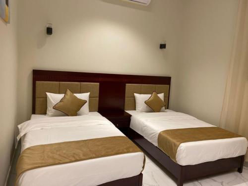 Cama ou camas em um quarto em Qaser Sadan