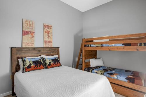 a bedroom with a bed and a bunk bed at Loon Escape in Lincoln