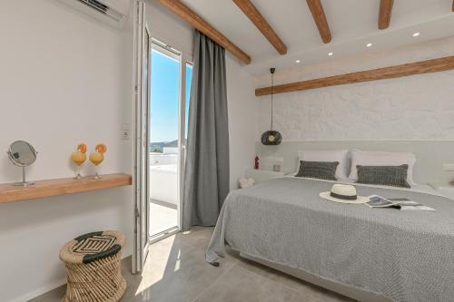 Posteľ alebo postele v izbe v ubytovaní Naxos Blue Sky
