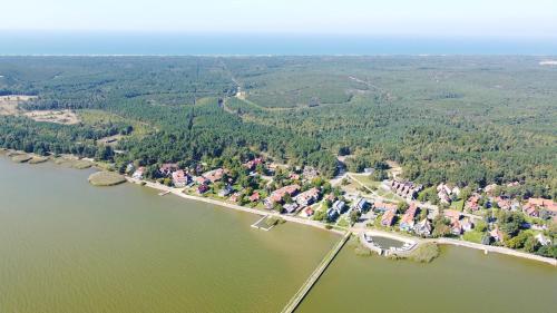 an aerial view of a lake with houses and trees at Vila Deva in Neringa