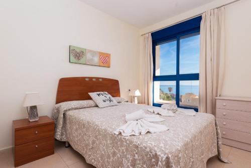 A bed or beds in a room at Apartamento Cuellar 3 - PlusHolidays