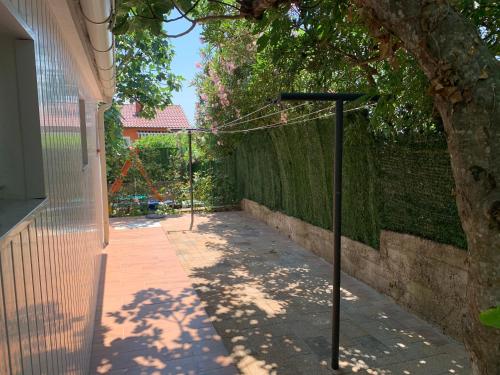 a street light on a sidewalk next to a fence at Villa KRK-4 bedrooms, 4 bathrooms with heated pool and jacuzzi, 150m from the sea in Krk
