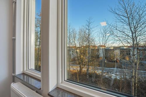 a window with a view of a city at Uppsala Hotel Apartments in Uppsala