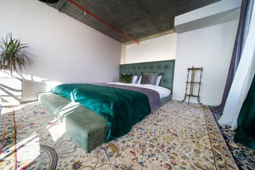 a bedroom with a bed and a couch in a room at Ati Ambavi Botique Hotel Gudauri in Gudauri