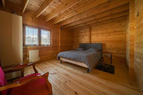 Ein Bett oder Betten in einem Zimmer der Unterkunft Chalet L'Abitiz