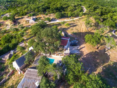 an aerial view of a farm with a car parked in a field at Luxury house Ivan with 4 bedrooms in Divojevići