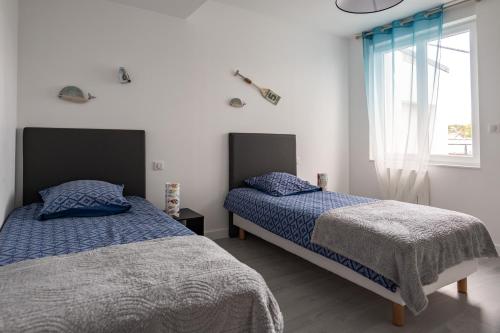 Postel nebo postele na pokoji v ubytování Salicorne